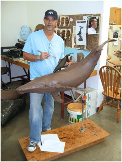 wyland-working-on-bronze-table Wyland working on bronze sculpture for a table